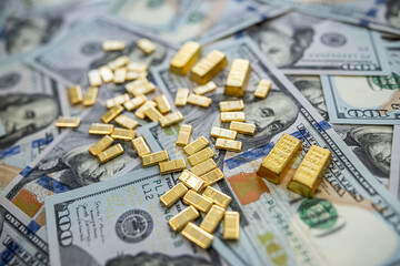 Pile of gold bars with dollar money representing inflation hedge and global market opportunity