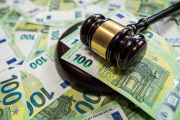Judge gavel on euro banknotes symbol of justice and financial decision