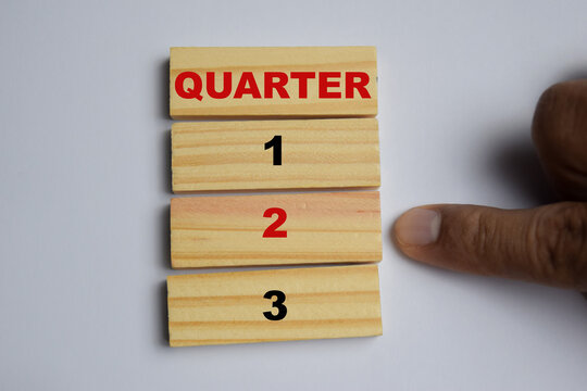2nd quarter 2 symbol stacked wooden cubes on the table. Quarter 2 business and finance concept