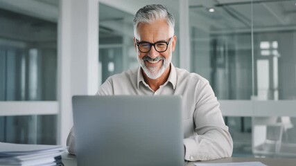 Happy Senior Businessman Working on Laptop in Modern Office - Powered by Adobe