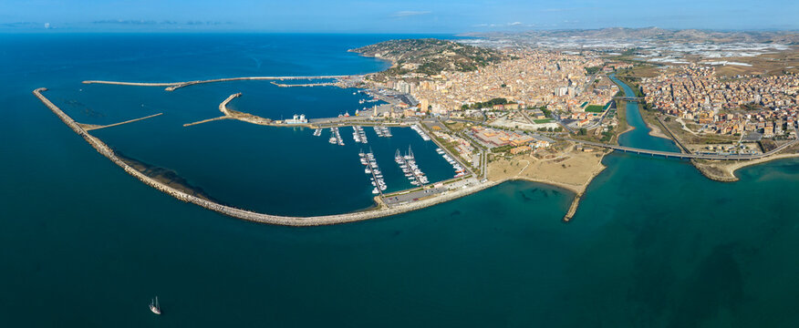 Panoramic aerial view of the city and port of Licata, a small town in the province of Agrigento, Sicily, Italy. The city overlooks the Mediterranean Sea.