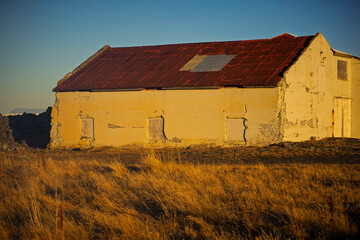 Old Abandoned Building in Golden Sunset Light, Iceland