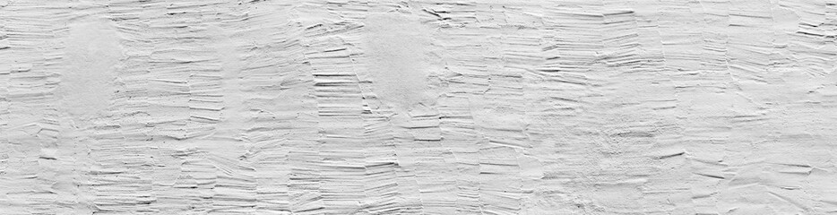 Plastered white house wall in panoramic format.