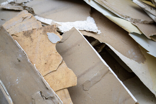 Construction Debris & Waste: Broken Drywall, Plasterboard, and Wood Fragments - High-Resolution Close-Up