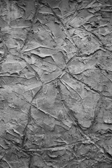 gray background, in the photo the texture of a gray wall with various lines, strokes and cracks