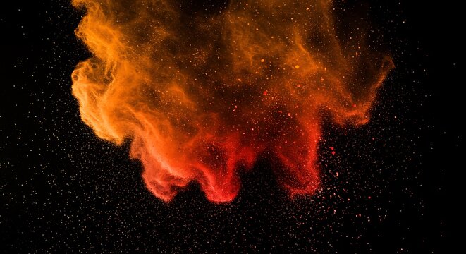 Abstract orange and red powder explosion isolated on black background