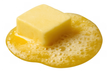 Butter block melting, transforming into golden liquid fat, dripping and bubbling from heat, isolated on transparent background