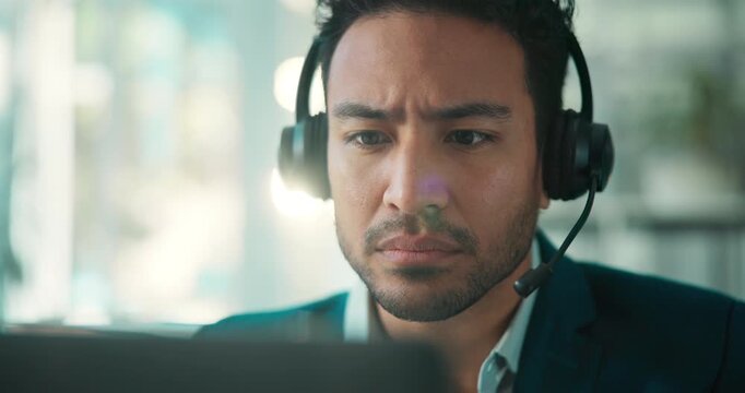 Serious, call center and Asian man in office, laptop and customer service with system solution. Person, employee and consultant in workplace, headset and computer with internet and online reading
