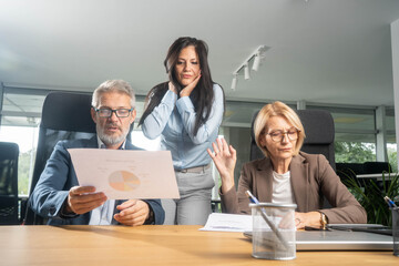 Team of professionals debating and facing conflicts during a business project meeting