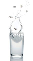 Coconut water splash with coconut pieces in glass on white background summer drink