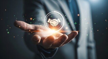 Business professional holding a glowing digital handshake icon in their palm