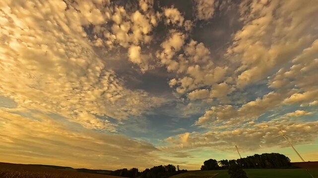 4K Timelapse video with moving clouds and wind power plants near Kugl, Simbach bei Landau, Dingolfing-Landau, Bavaria, Germany