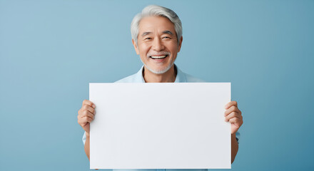 Happy Senior Asian Man Holding Blank Sign