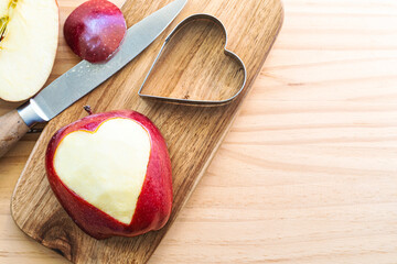 Red apple with carved heart
