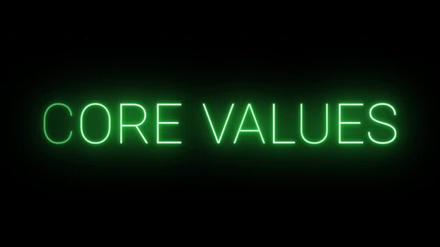 Flickering neon green Core values sign animated on black background.
