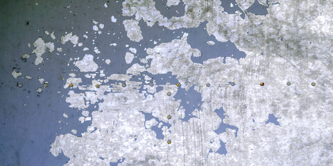 Light blue peeling paint on the old grunge steel surface - textured background