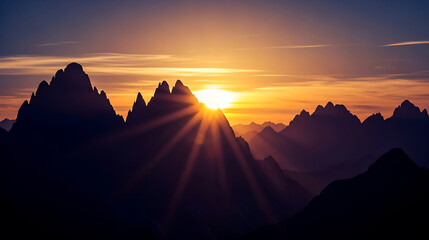 Sun setting over the mountains with rays of light