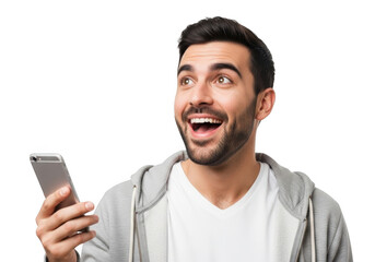 A delighted young man with a beard holds a smartphone and looks upwards with an excited expression isolated on transparent background