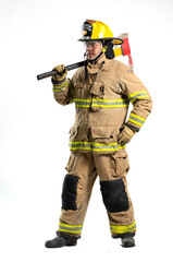 A firefighter in full turnout gear stands confidently with a rescue axe
