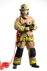 Portrait of a firefighter in protective uniform holding a firefighting and fire hose nozzle