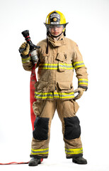 Portrait of a firefighter in protective uniform holding a firefighting and fire hose nozzle