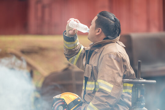 A feeling regret of a firefighter, sit and rests after performing an emergency response