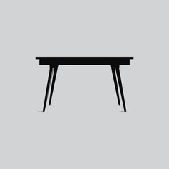 A minimalist black table with angled legs stands isolated against a soft gray background