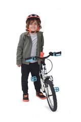 Front view of a child standing with his bicycle on a white background