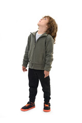  boy dressed in sportswear looking up on a white background