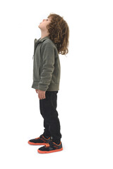 side view of  boy dressed in sportswear looking up on a white background