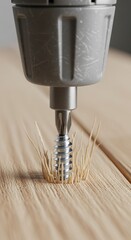 A close-up of a drill bit boring into wood, revealing a screw surrounded by wood shavings, showcasing a woodworking process.