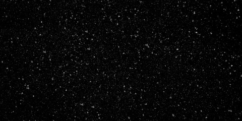Snow texture overlay with very small, blurred white particles falling against an isolated dark black background horizontally
