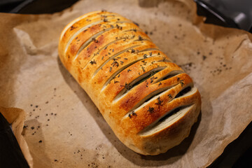 Close-up of homemade vegan Wellington on parchment paper.