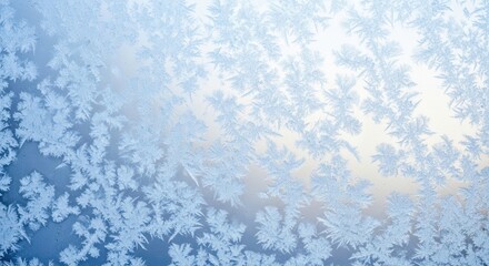 Frosty window pane with intricate ice crystal patterns in winter season