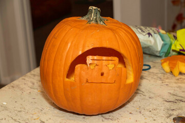 familymade pumpkin with gentle lighting, handcrafted squash with soft candle illumination