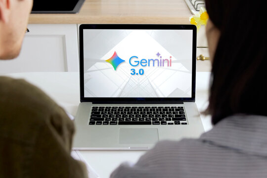 People watching gemini 3.0 ai software on a laptop computer