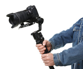 Fototapeta premium Videographer using gimbal stabilizer with camera on white background, closeup