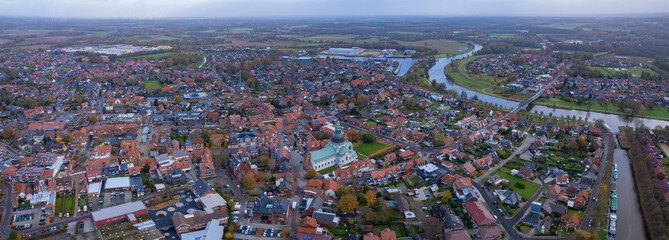 An aerial panorama view above the old town of the city Haren (Ems), 49733 on an early summer morning in Germany