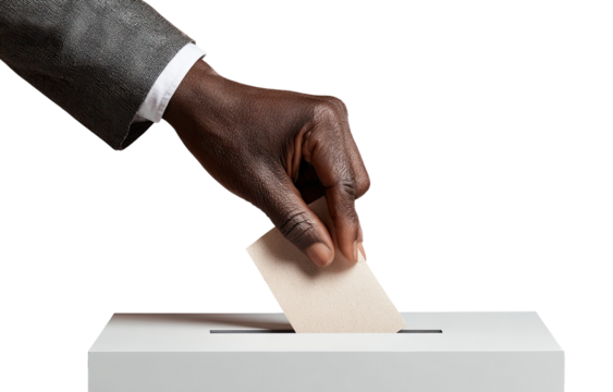 A hand in a suit jacket places a ballot into a voting box - Powered by Adobe