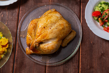 Couscous with dried fruits and turmeric, baked whole chicken, flatbread