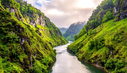 Calm river flowing between steep green cliffs
