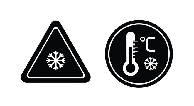 Black and white warning signs depicting ice and freezing temperatures
