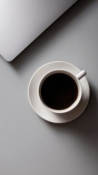 34. flat lay of modern workspace with laptop and coffee, editorial style, controlled studio lighting, balanced rule of thirds, ideal for online ads