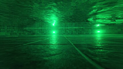 a man swimming in a pool