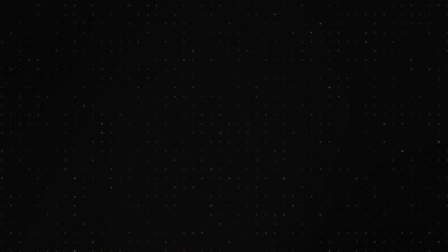 Abstract background of golden dots that light up and go out randomly on a dark background.