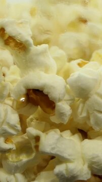 Close up of spinning popcorn inside popcorn maker