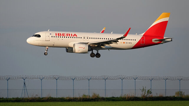 Iberia airlines plane landing at Prague International Airport in the Czech Republic in evening light