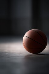 Obraz premium 235. basketball on court under spotlight, professional tone, natural window light, clean background for typography, generic props only