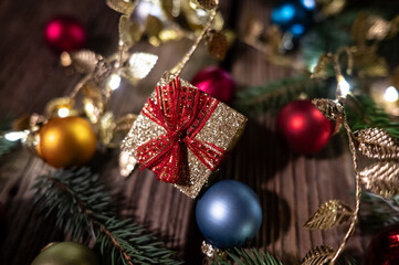 Golden Christmas Gift Box with Baubles and Festive Decorations