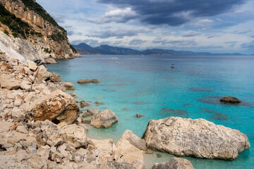 Cala Goloritzè, unique place to admire thanks to its crystal clear waters, white pebbles and surrounding cliffs. Part of Gennargent national park and can be reached on foot or by boat